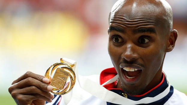 Mo Farah shows off his gold medal after winning the Men's 5,000m at the IAAF World Championships.