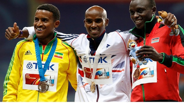 Mo Farah poses with silver medallist Hagos Gebrhiwet of Ethiopia and bronze medallist Isiah Kiplangat Koech of Kenya.