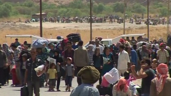 Thousands of Syrian refugees have poured into the Kurdistan region of northern Iraq.