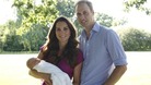 Prince George is held by his mother the Duchess of Cambridge.