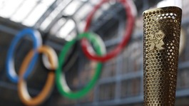The Olympic torch and Olympic rings.