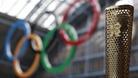 The Olympic torch and Olympic rings.