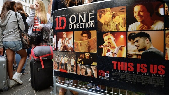 Girls who have camped out since Sunday night, queue up for wristbands for entry to pens outside the Empire Cinema.