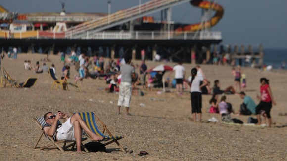 People enjoy the sun at Great Yarmouth beach in Norfolk.