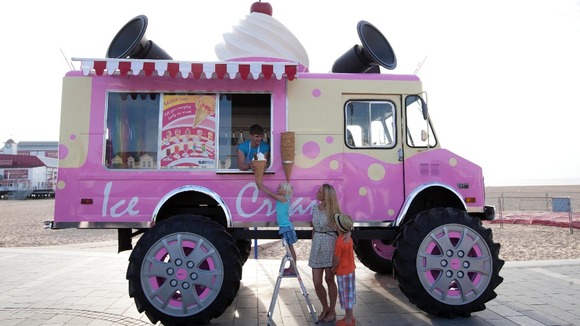 Amelia Enright with eight year old Leighton, and Charlotte, five, from Norfolk enjoy free ice creams.