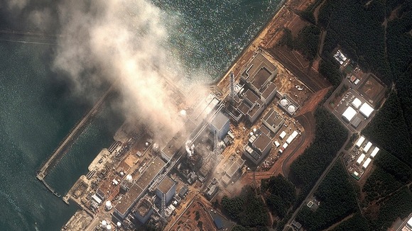 The Fukushima Daiichi nuclear plant is seen burning after it was destroyed by an earthquake and tsunami in March 2011
