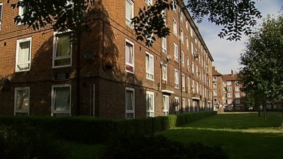 Two people have been arrested after the woman fell from a block of flats yesterday