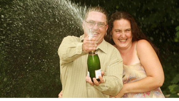Tracy Tyler, 37 and partner Adam Young, 30 from Epping who have won £5.819.806 with a lucky dip ticket on the National Lottery