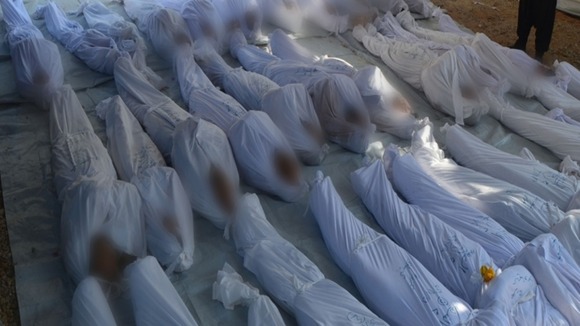 Rows of bodies in a mortuary in the Duma neighbourhood of Damascus