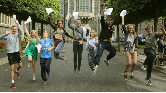 Students at Brighton College in East Sussex, celebrate their GCSE results.