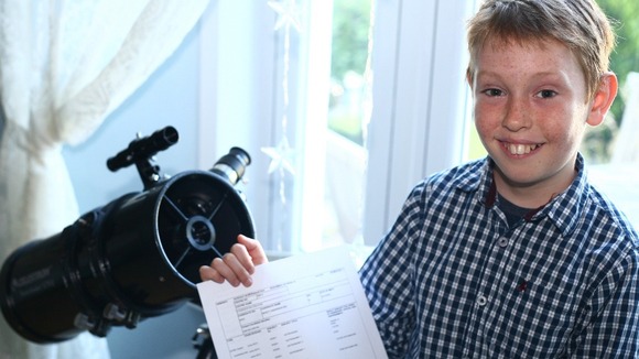 Monty Rix, 10, shows off his B grade GCSE in astronomy.