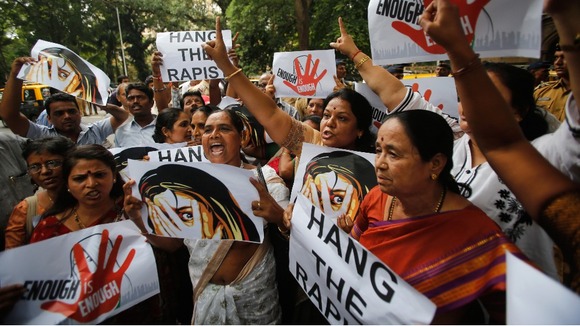 Supporters of Republican Party of India (RPI) shout slogans during a protest against the rape.