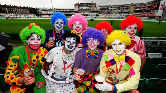 Fans dressed as clowns