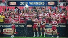 Wigan Warriors celebrate with the trophy after winning the Challenge Cup Final at Wembley Stadium, London.