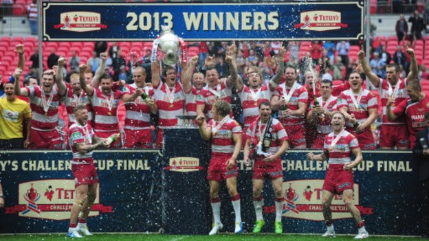Wigan Warriors celebrate with the trophy after winning the Challenge Cup Final at Wembley Stadium