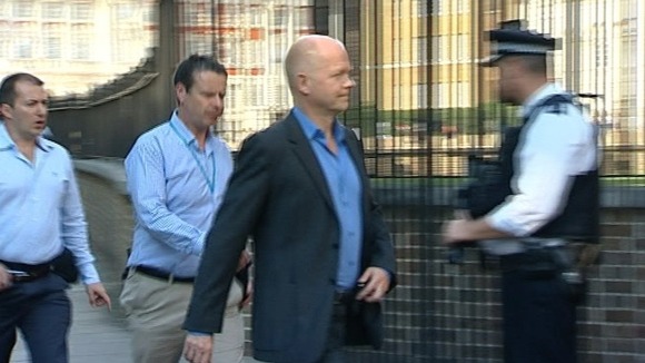 Foreign Secretary William Hague walking into the back entrance to Number 10