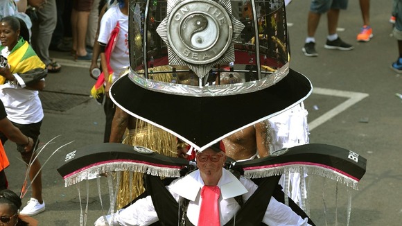 A man dresses up as police helmet at Carnival!