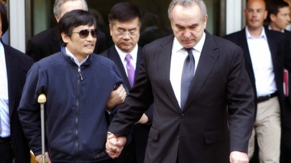 Chen Guangcheng (2nd L) being accompanied by U.S. Assistant Secretary of State for East Asian and Pacific Affairs Kurt Campbell (front R)