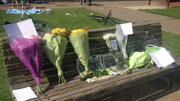 Flowers left by the River Cam to pay tribute to Andy Collings.