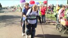 Claire walking in her robotic suit.
