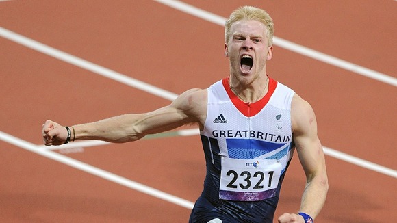 Great Britain's Jonnie Peacock celebrates as he crosses the line to win the Men's 100m - T44 Final, during the Paralympic Games in London.