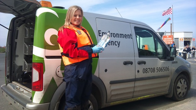 Woman next to van