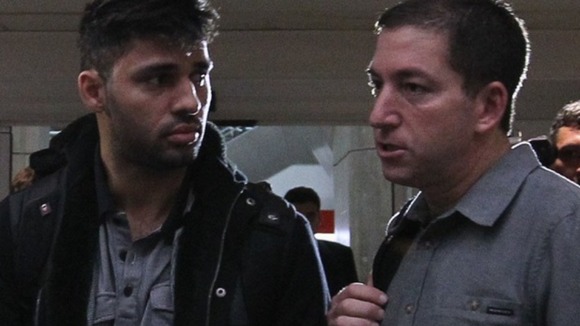 David Miranda with journalist Glenn Greenwald at an airport in Brazil.