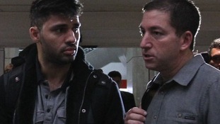 David Miranda with journalist Glenn Greenwald at an airport in Brazil.