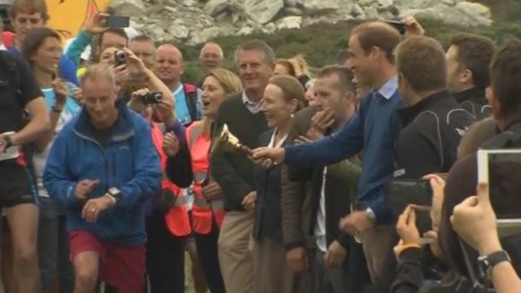 The Prince rings a bell to start the mammoth marathon.