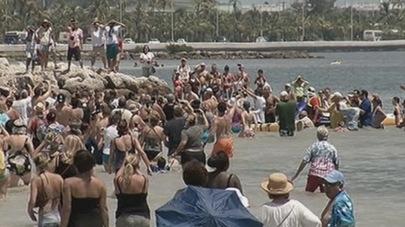Well-wishers rush to cheer Diana Nyad as she completes her Cuba to Florida journey.