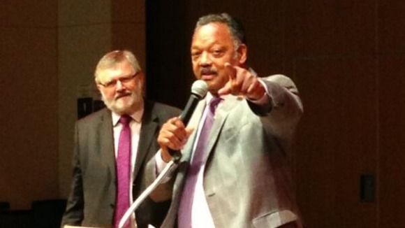 Civil rights activist Rev Jesse Jackson has arrived to rapturous applause