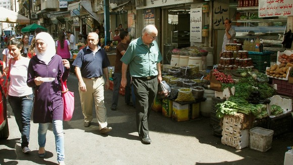 Syrians shop at a market in Damascus.