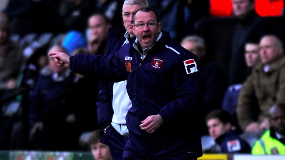 Greg Abbott shouts instructions from the sideline as Carlisle took on Notts County in March.
