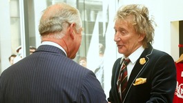 Prince of Wales smiles as he speaks with Rod Stewart and Penny Lancaster