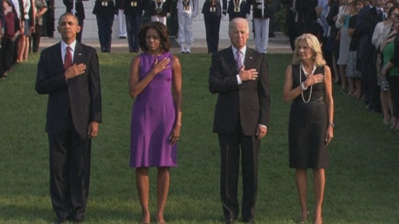 The Obamas and the Bidens observe a moment of silence outside the White House.