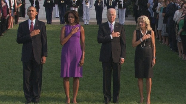 The Obamas and the Bidens observe a moment of silence outside the White House.