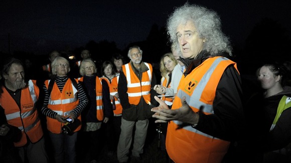 Queen guitarist Brian May addresses members of a Wounded Badger Patrol in Gloucestershire