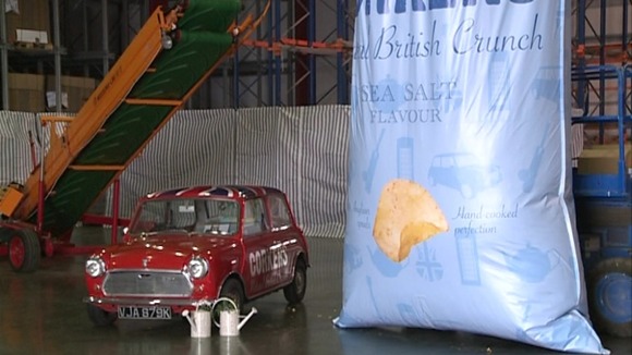 The bag of crisps is 760 cm x 380 cm holding a massive 1 tonne of crisps.