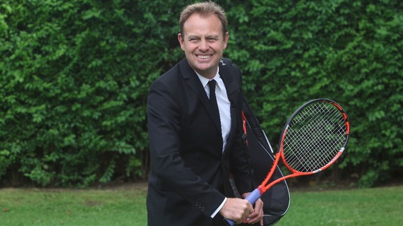 Racket and case held by Jason Donovan