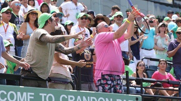 Fan catches Murray's racket