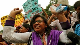 Demonstrators rejoice at the sentencing of the men for the rape and murder of the victim who has been symbolically named "Damini"