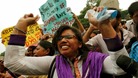 Demonstrators rejoice at the sentencing of the men for the rape and murder of the victim who has been symbolically named "Damini"