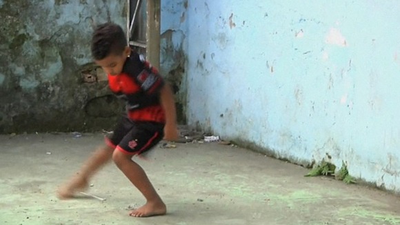 A child practicing Passinho in Rio de Janeiro