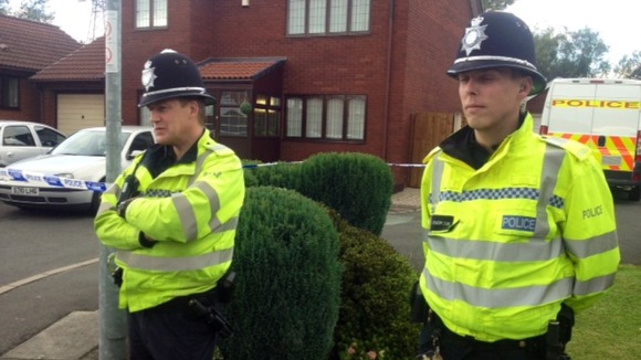 Police are stationed outside the house