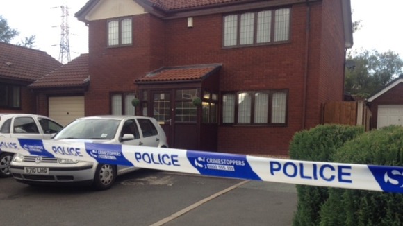 Police tape surrounds the house in Victory Road