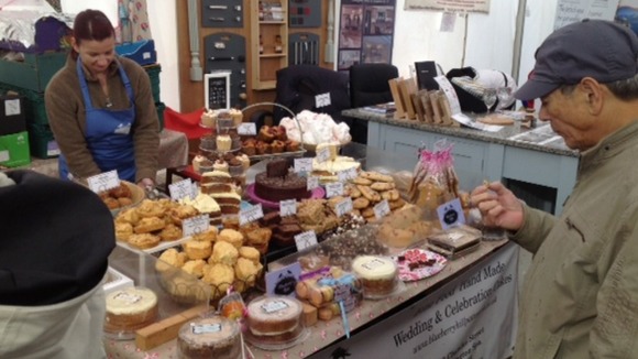 A visitor tries one of the homemade cake stands