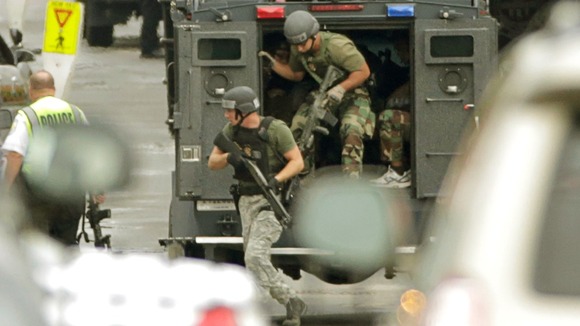Member of a SWAT team deploy at the Navy base in Washington