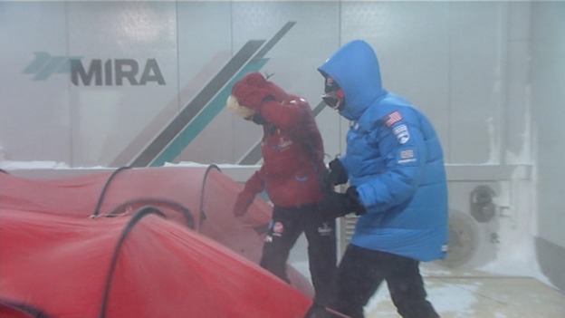 Two members of the team battle the wind in the chamber.