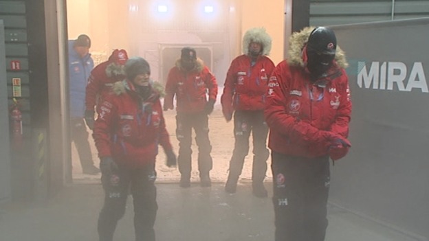 Coming out from the cold, the team emerge from the cold chamber.