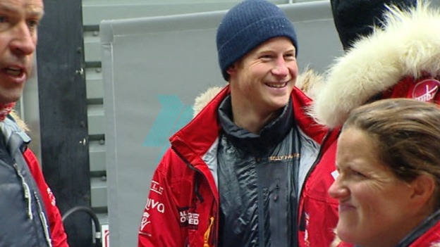 The prince jokes with members of the team.